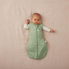 ErgoPouch Cocoon Swaddle Sack 1.0 TOG with arms-out and snaps for easy changes.