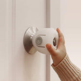 EUDEMON door knob covers installed on a door knob to help keep toddlers safe.