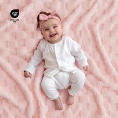 EverGraceHome checkered blanket pink fabric close-up, plush sherpa feel.