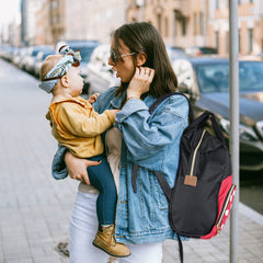 Exttlliy diaper bag backpack with waterproof interior for spill cleanup.