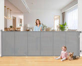 EZIGO 120-inch retractable gate extended across a wide doorway for child and pet safety.