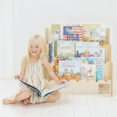 Fable Twig wooden kids bookshelf with scalloped edges keeps picture books within reach.