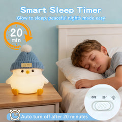 Famiduo penguin lamp on bedside table, ideal for night-time reading and safety.