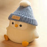 Famiduo Penguin Lamp with Knit Hat, front view, provides a gentle, comforting glow.