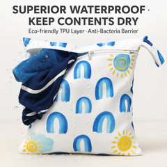 FANALALA wet-dry bag with hanging strap attaches easily to strollers for on-the-go.