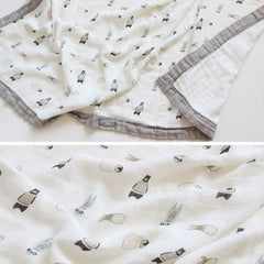 Farmer Mani swaddle gray wraps newborn securely and comfortably.