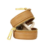 Fawn Design Paci Case in tan vegan leather with clip for on-the-go pacifier access.