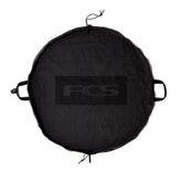 FCS Change Mat rolled for compact storage, ideal for portable wetsuit changes