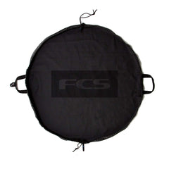 FCS Change Mat rolled for compact storage, ideal for portable wetsuit changes