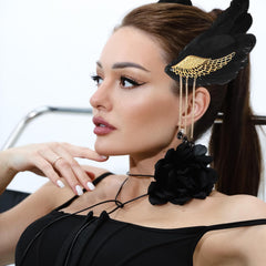 Black feather clip complements bridesmaids or bride ensembles