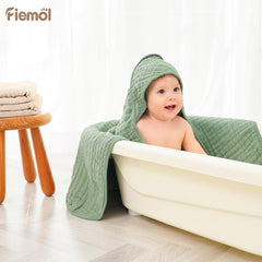 FIEMOL newborn wrapped in hooded towel demonstrates quick warmth