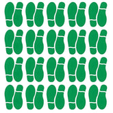 Finduat green footprint stickers on classroom floor guide students' footsteps along the line.