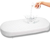 First Essentials bassinet mattress close-up with a 3-inch core for support.