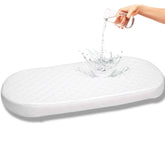 First Essentials bassinet pad with soft cloud foam for newborn comfort and gentle support.