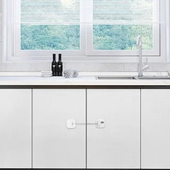 FKTUV fridge lock adhesive pad close-up demonstrates strong grip on surfaces.