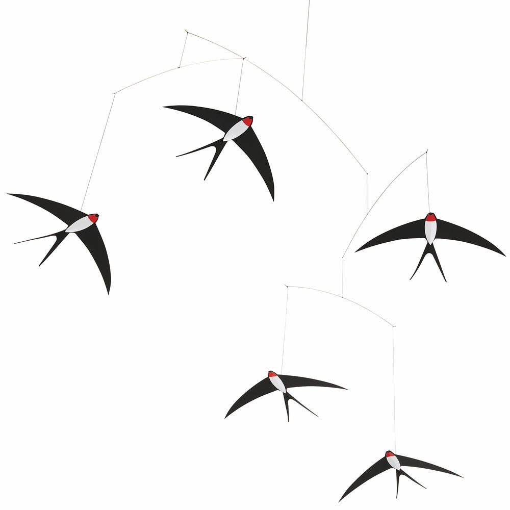 Flensted 5 swallows mobile hanging over bed for calming ambience.