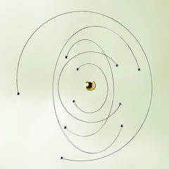 Flensted Mobiles atom model side view in steel showcases precise suspended elements.