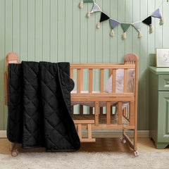 FLXXIE oversized 43x60 quilt displayed with nursery décor versatility.