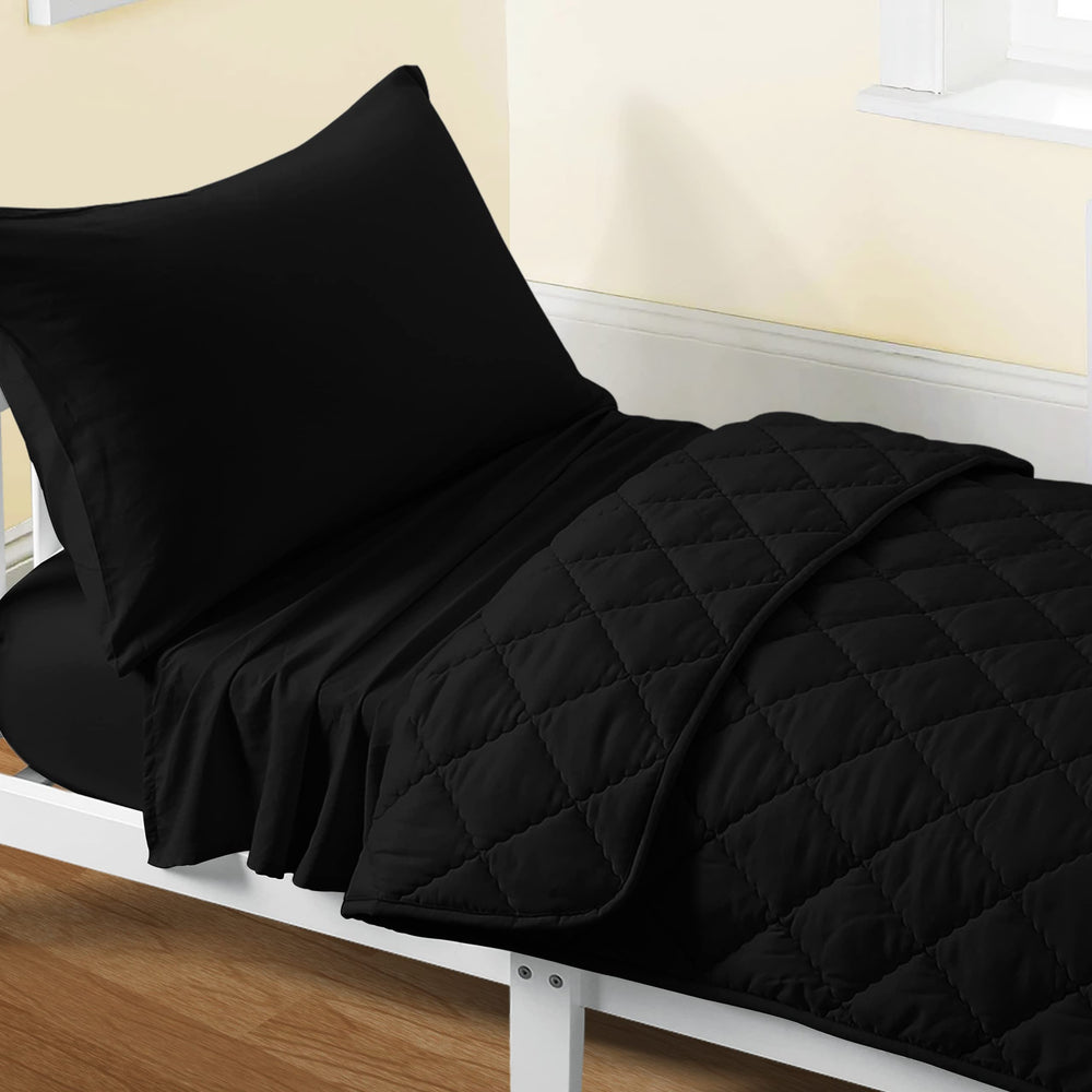 FLXXIE toddler bedding set in black shows quilt detail and durable comfort for active kids