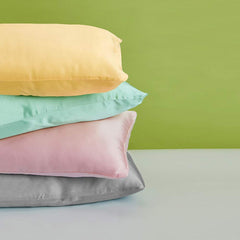 Closeup of FLXXIE satin pillowcase fabric showing silky texture and quality