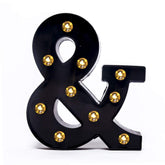 Foaky black LED marquee number lights hanging on wall for elegant wedding decor