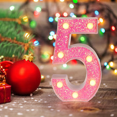 Foaky Pink Light Up Letters closeup with shiny round accents for sparkle.