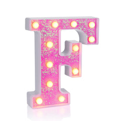 Foaky pink light up letters glow softly for festive party decor.
