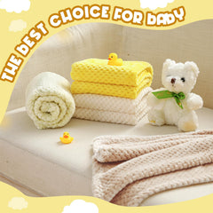 Frienda yellow fuzzy blanket on crib showing large size and cozy texture.