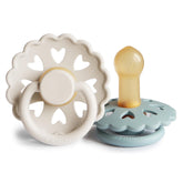 Frigg Andersen Fairytale cream packaging highlights premium natural rubber pacifier for soothing comfort.
