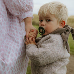 FRIGG Little Viking pacifier security handle for easy inspection and grip