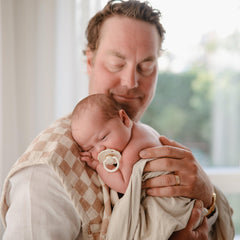 FRIGG pacifier air holes detail offers breathability for sensitive gums.