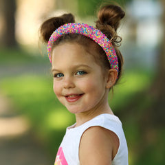 FROG SAC sprinkle headband worn by a girl demonstrates colorful daily accessory that stays put.