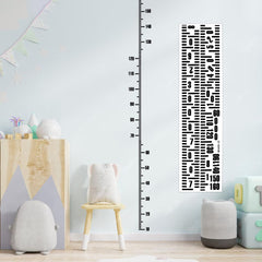 Fssqii height sticker wall chart on a clean wall showing growth milestones