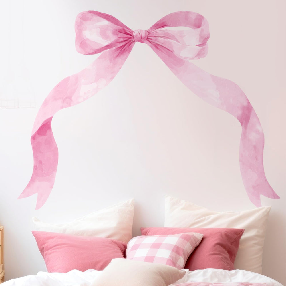 Fullhawl pink bow wall sticker adds playful charm to a girl's bedroom.