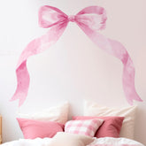 Fullhawl pink bow wall sticker adds playful charm to a girl's bedroom.