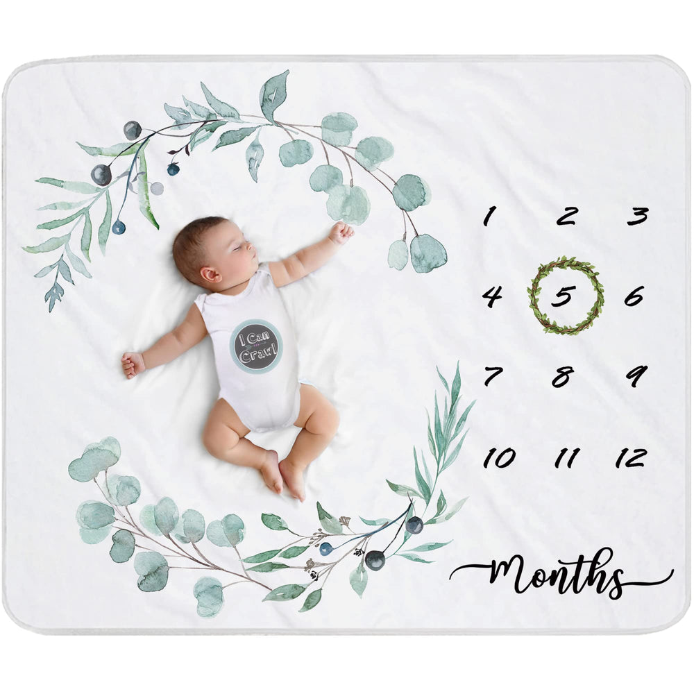 Fundich baby milestone blanket setup with ivy wreath for monthly photos.