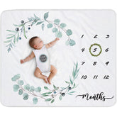 Fundich baby milestone blanket setup with ivy wreath for monthly photos.