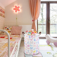 FXOCSHE Butterfly Laundry Basket with waterproof lining contains damp items.