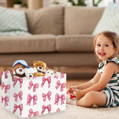FXOCSHE Delicate pink bow nursery hamper keeps laundry contained and portable.