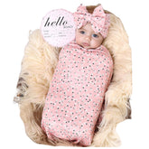 Galabloomer receiving blanket flower print offers a cozy, safe layer for newborn snuggle time.