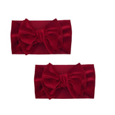 GANPUB two-pack baby bow headbands with turban-wide knots, secure enough for busy playtime.