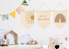 GEANHIL Canvas baby flag wall decor adds warmth to bedrooms with beige tones.