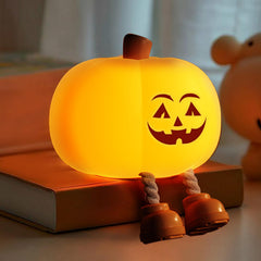 Gefaxi pumpkin night light with smiling face brightens a cozy kids' room.