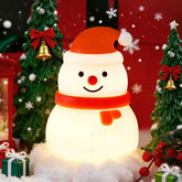 Gefaxi Squishy Christmas Snowman Night Light hanging on a tree with warm glow for cozy decor