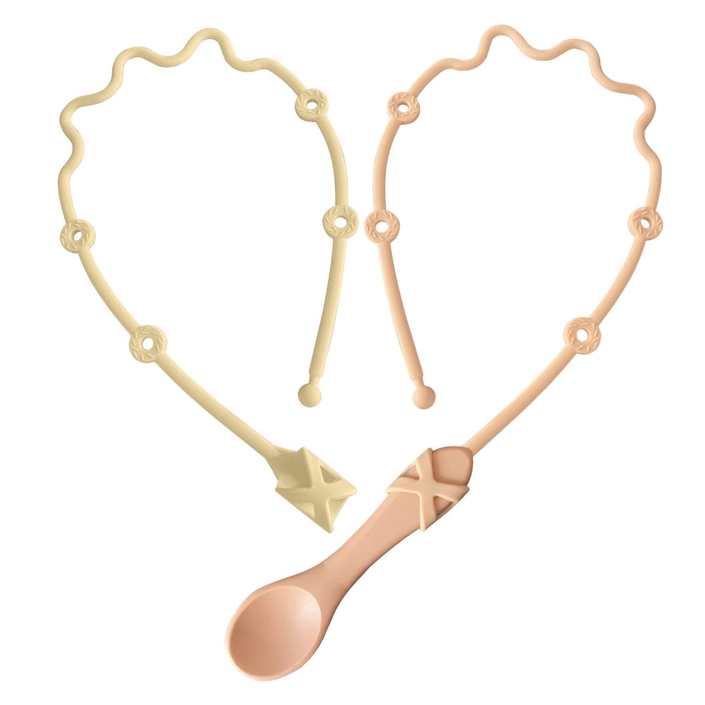 Gelinor pacifier clip close-up in pink keeps utensils within reach for easy self-feeding.