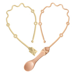 Gelinor pacifier clip close-up in pink keeps utensils within reach for easy self-feeding.