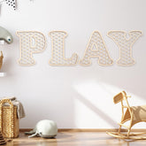 Generic Play Sign with four wooden rattan letters for charming nursery wall decor.