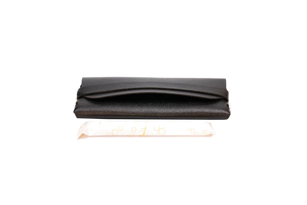 Generic TAMPONCASE travel tampon case in black keeps tampons secure.