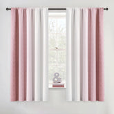 Geomoroccan ombre curtains in pink to white gradient for bedroom ambiance.