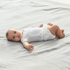 Gerber eight-pack waterproof diaper covers folded for compact packing and travel.